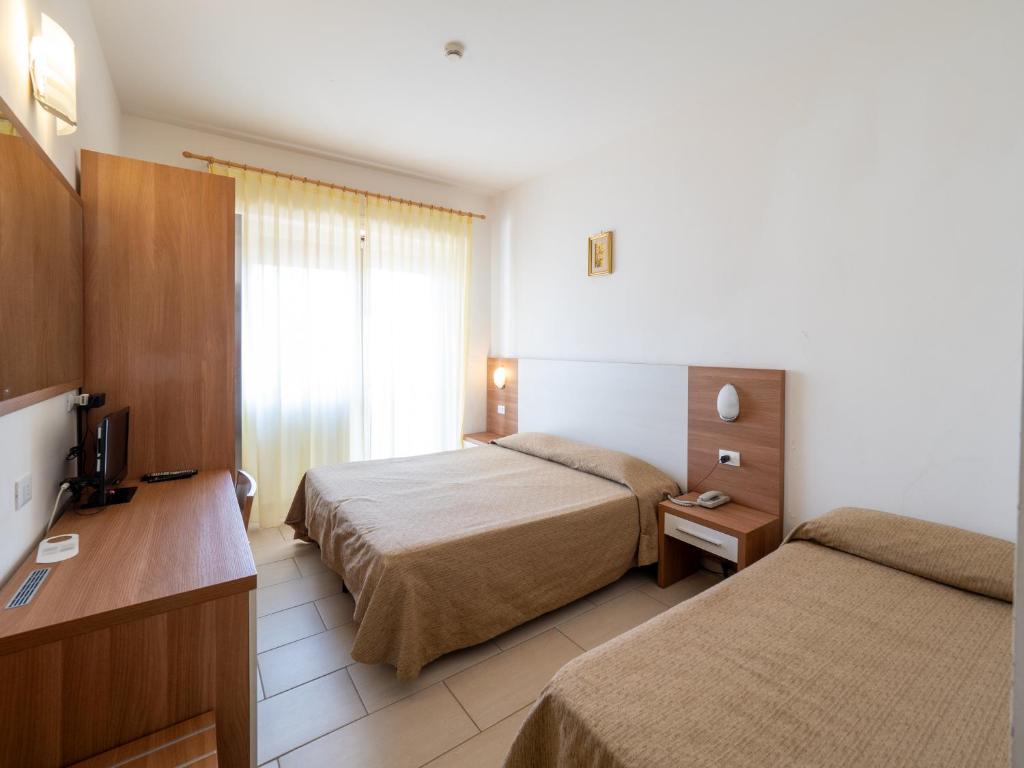 Postel nebo postele na pokoji v ubytování Hotel Blurelda