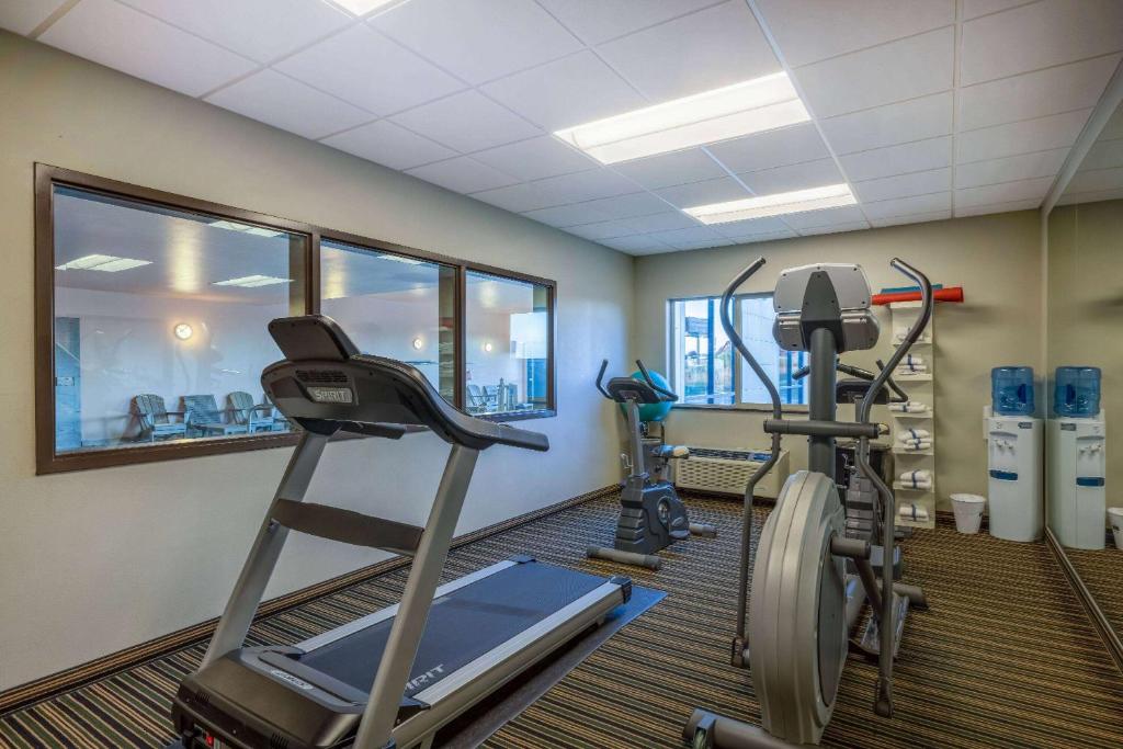a gym with two tread machines and a treadmill at Baymont by Wyndham Rapid City in Rapid City