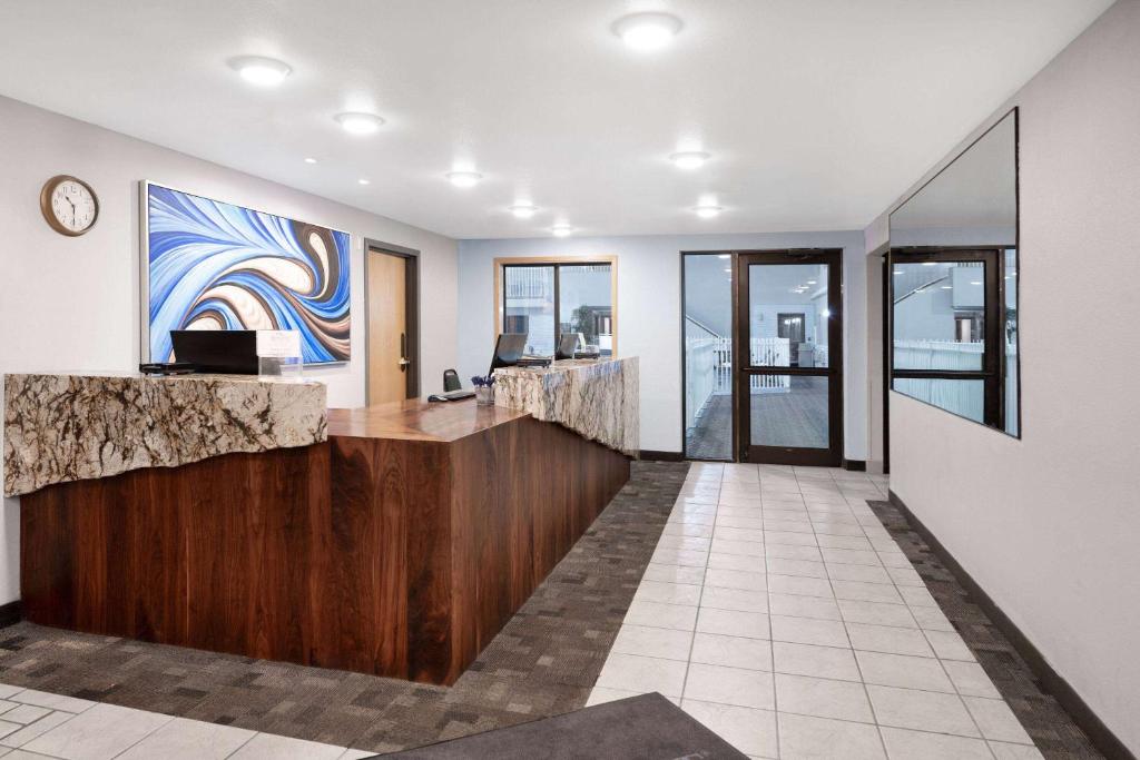 a lobby with a reception desk in a building at Baymont by Wyndham Keystone Near Mt. Rushmore in Keystone