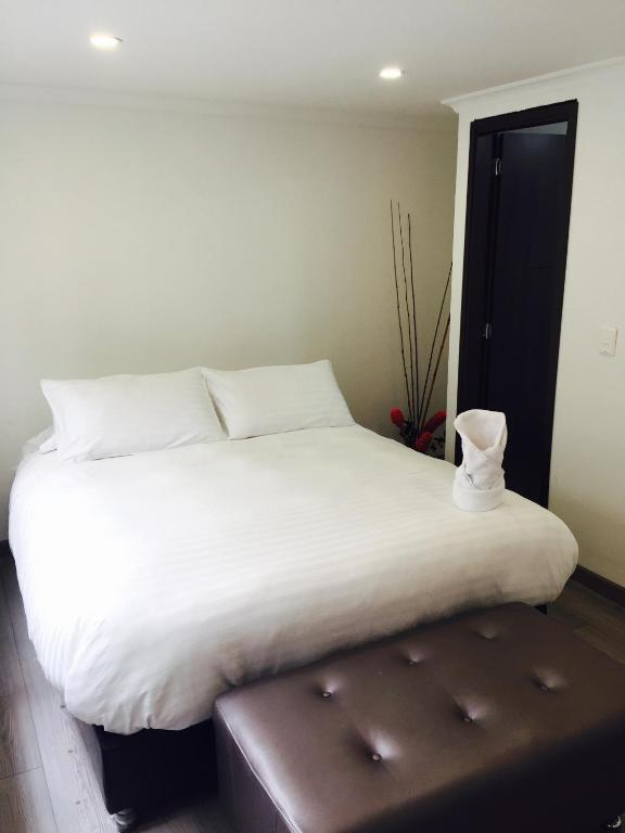 Postel nebo postele na pokoji v ubytování Hotel Metro 26