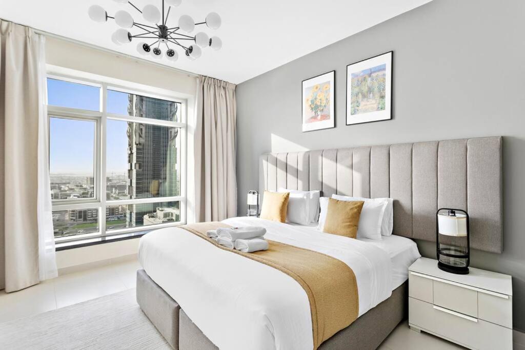 Postel nebo postele na pokoji v ubytování StoneTree - New Stylish 1BR Apartment in Downtown