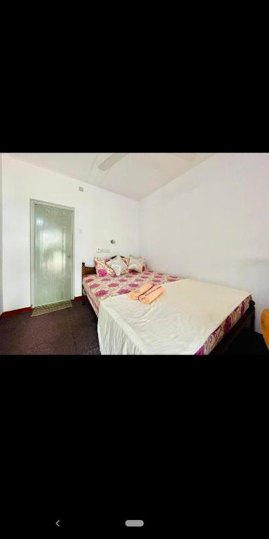 Voodi või voodid majutusasutuse Nethusaliguesthouse toas