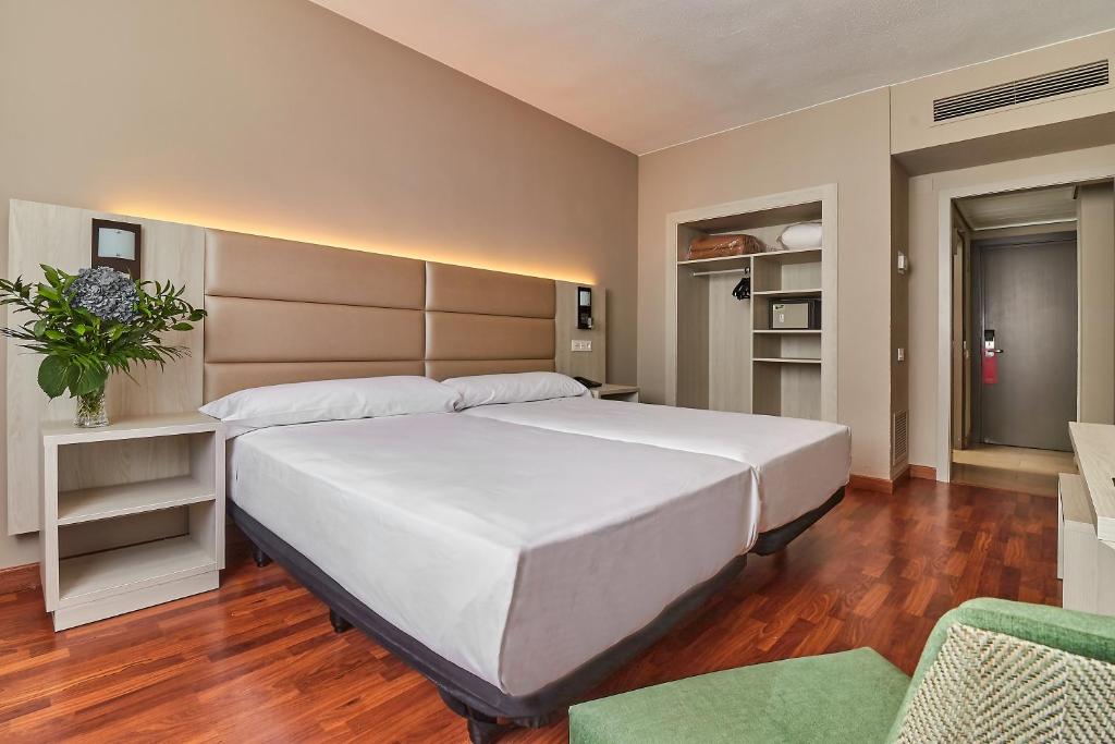 Postelja oz. postelje v sobi nastanitve Hotel Zaragoza Royal