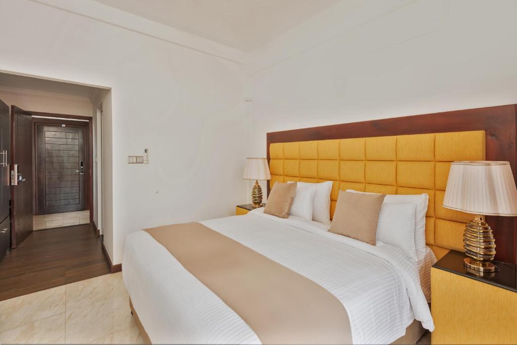 Postel nebo postele na pokoji v ubytování Beverly Beach Negombo