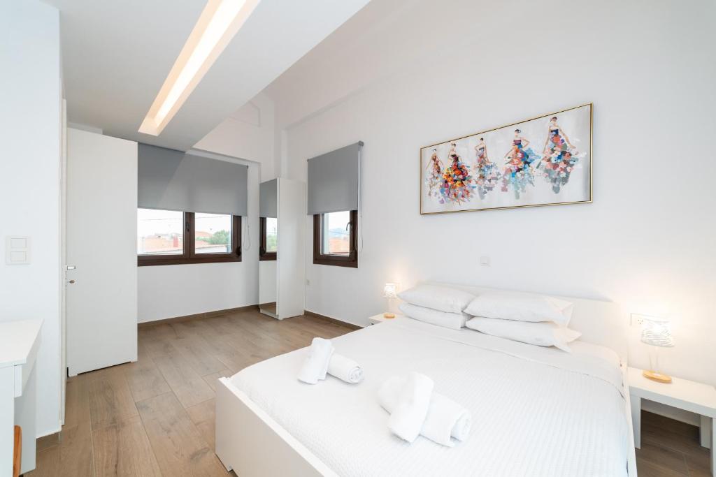Postel nebo postele na pokoji v ubytování Argilos & Argilos Deluxe Residential Complexes