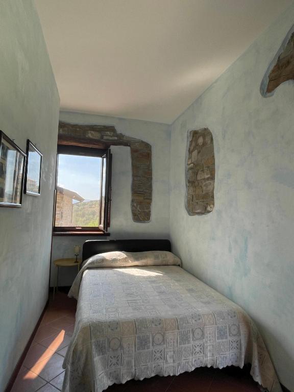 Łóżko lub łóżka w pokoju w obiekcie Agriturismo Piano di Andrea
