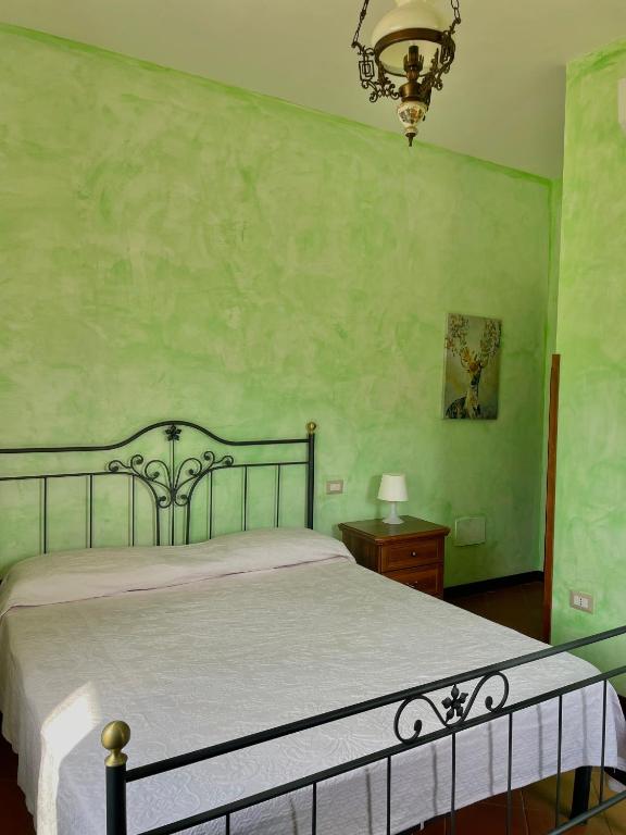 Łóżko lub łóżka w pokoju w obiekcie Agriturismo Piano di Andrea