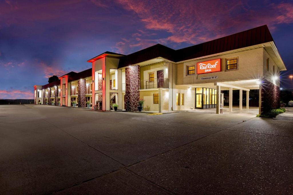 a empty parking lot in front of a motel at Red Roof Inn Forrest City in Forrest City