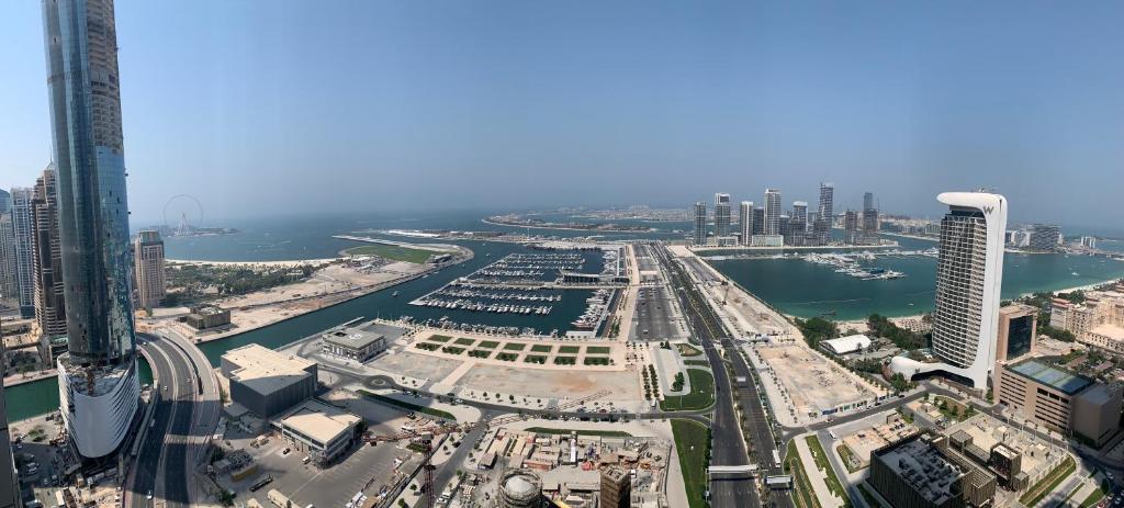 an aerial view of a city with a harbor at The Mood House I Dubai Marina in Dubai
