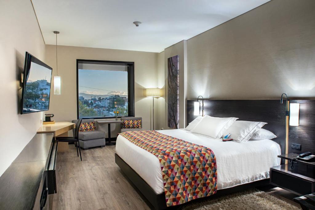Postel nebo postele na pokoji v ubytování Cité Hotel