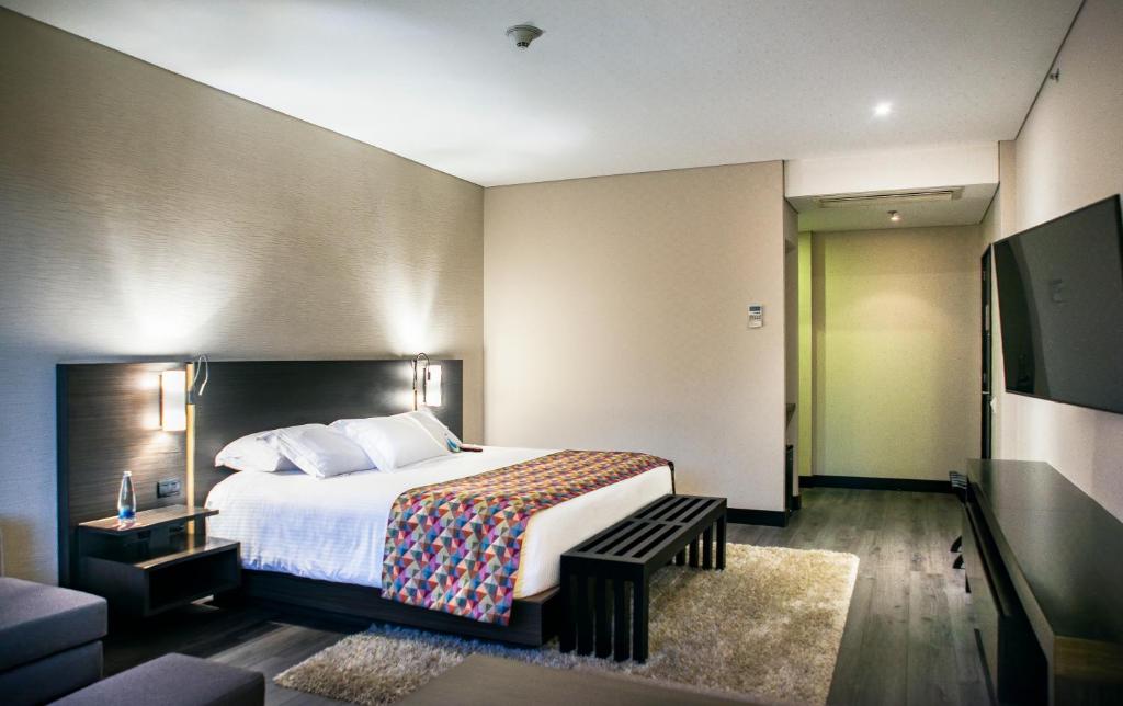 Postel nebo postele na pokoji v ubytování Cité Hotel