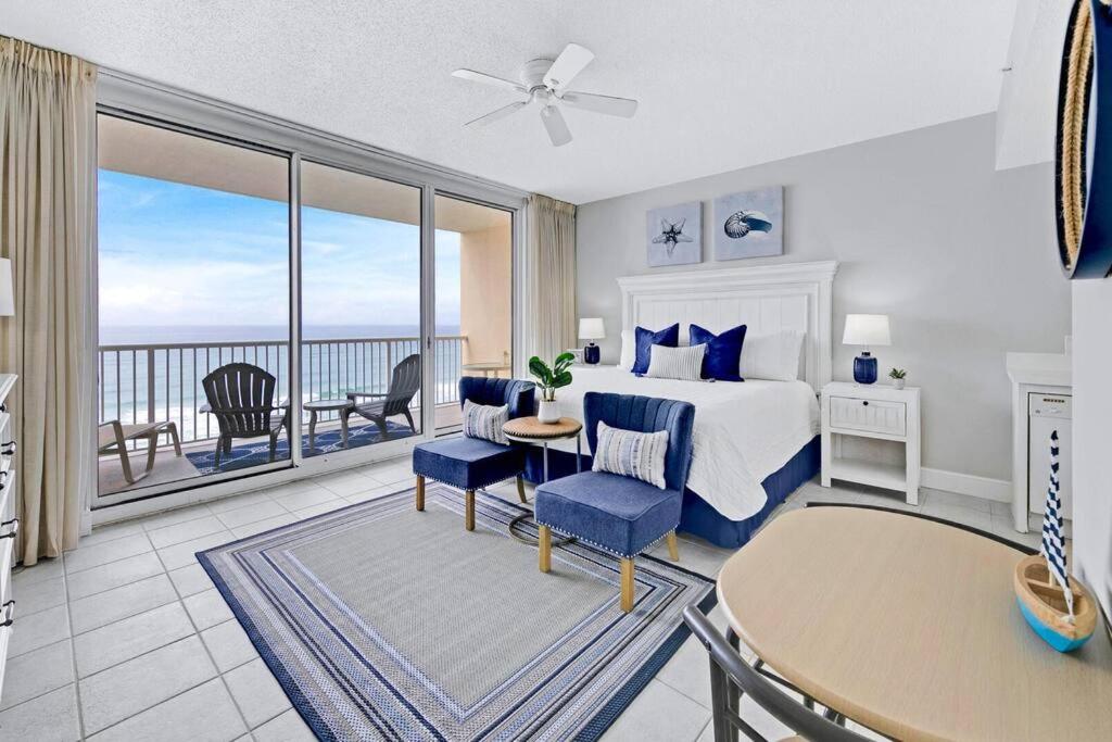 a bedroom with a bed and a view of the ocean at Beachfront Condo #712 at Majestic Beach Resort in Panama City Beach