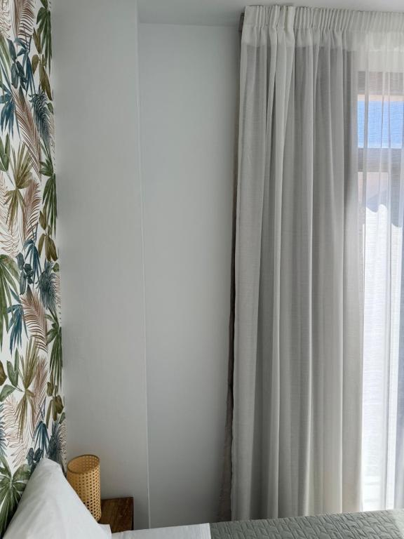 Posteľ alebo postele v izbe v ubytovaní Plaza Victoria Apartments