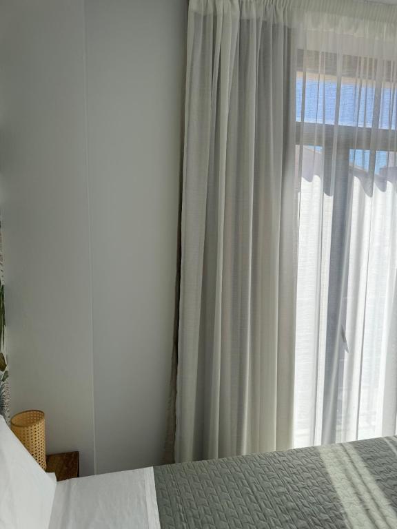 Posteľ alebo postele v izbe v ubytovaní Plaza Victoria Apartments