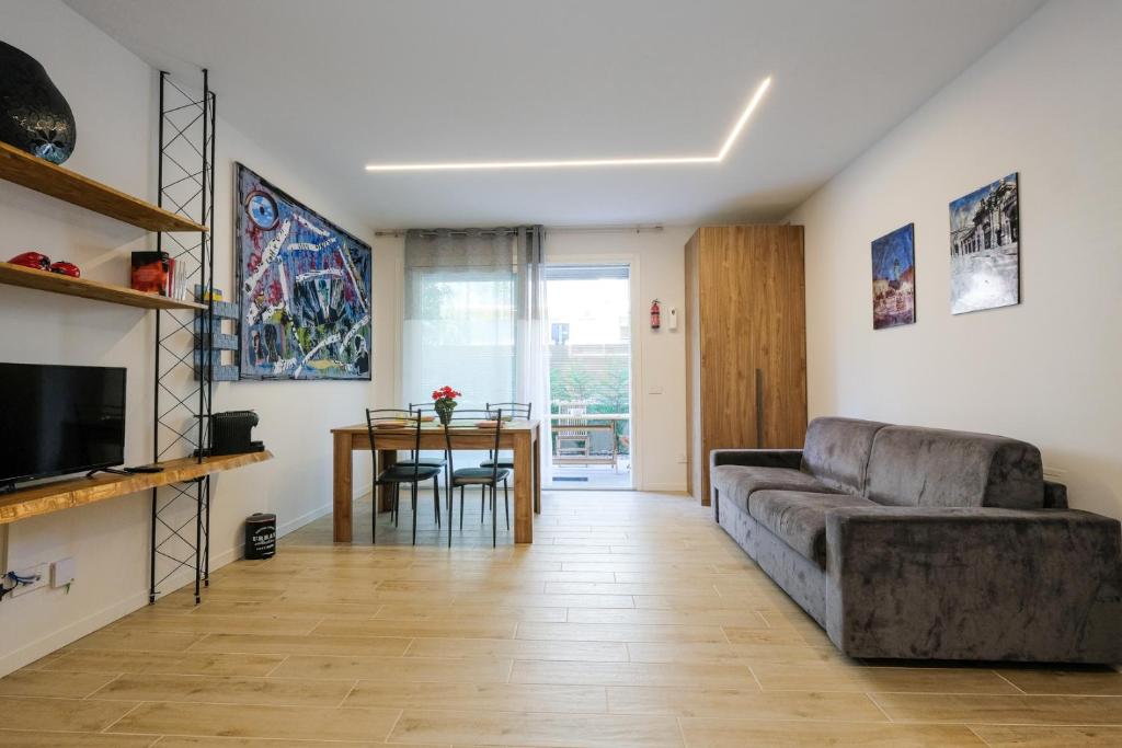 a living room with a couch and a table at BergamoCityCenter 02 in Bergamo