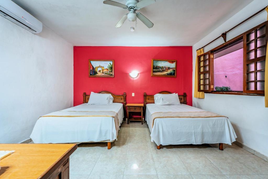 Postel nebo postele na pokoji v ubytování Hotel Santa Lucía