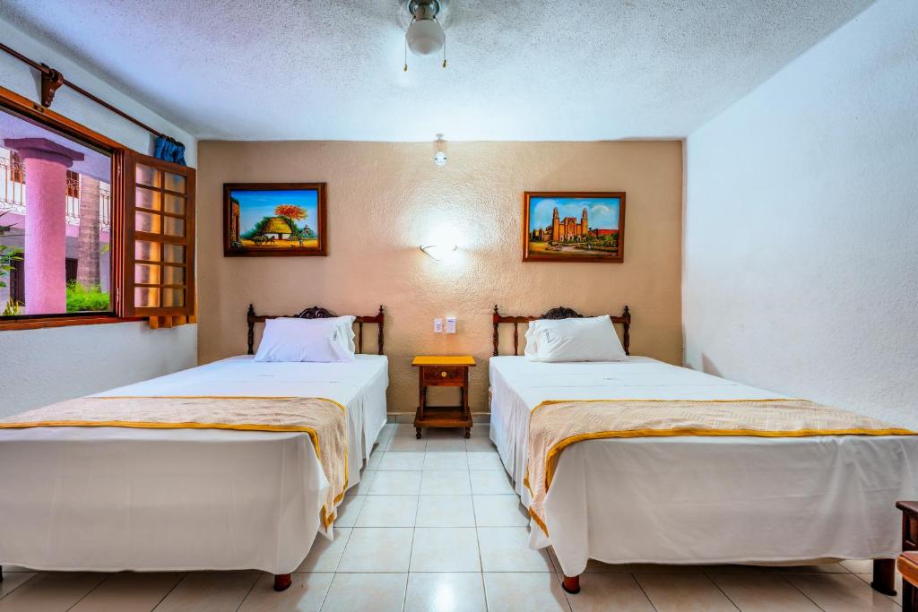 Postel nebo postele na pokoji v ubytování Hotel Santa Lucía