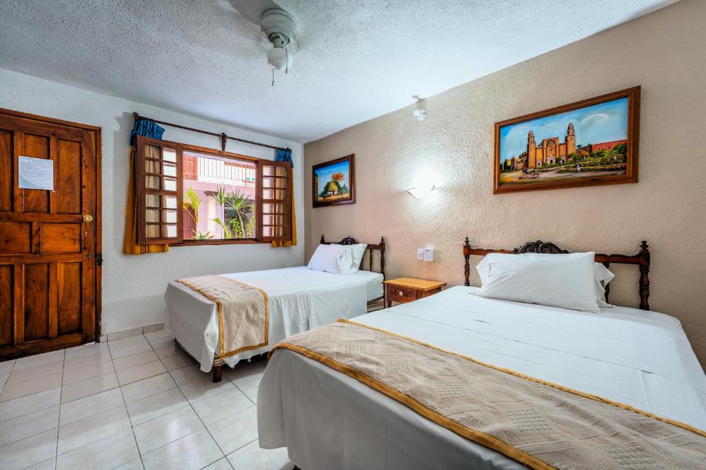 Postel nebo postele na pokoji v ubytování Hotel Santa Lucía