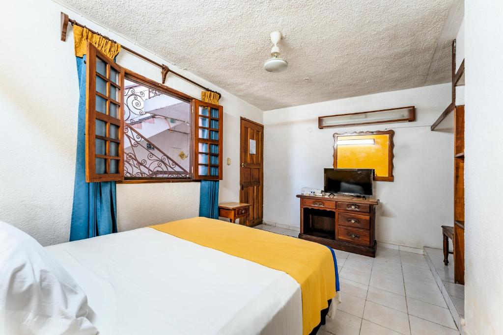 Postel nebo postele na pokoji v ubytování Hotel Santa Lucía