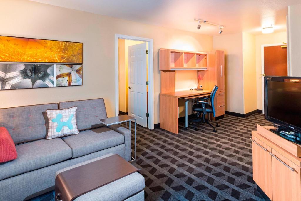 a living room with a couch and a desk at TownePlace Suites by Marriott Atlanta Kennesaw in Kennesaw