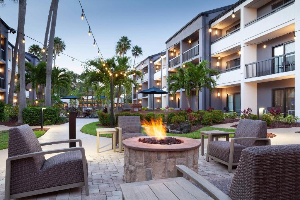 a fire pit in the courtyard of a hotel at Courtyard St. Petersburg Clearwater in Clearwater