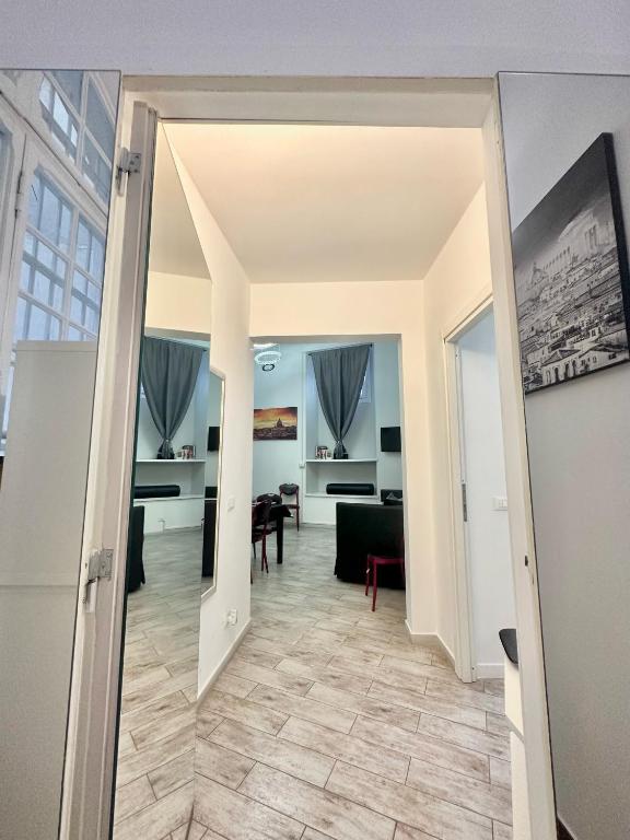 a hallway with a living room and a dining room at Appartamento Il Tempio Della Capitale in Rome