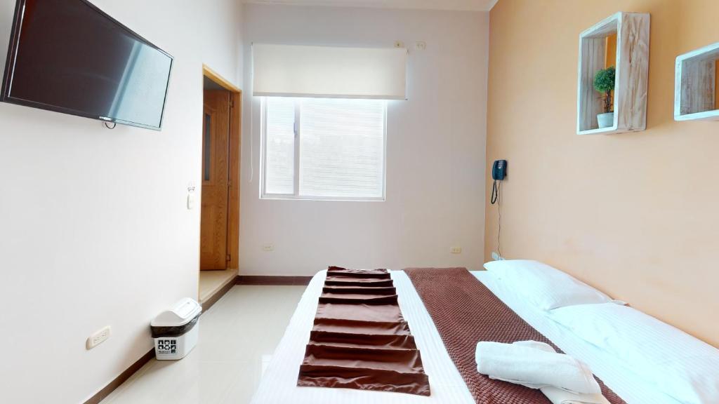 TV a/nebo společenská místnost v ubytování Hotel Villa Colonia
