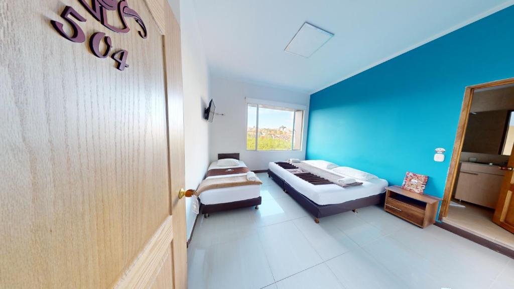 Postel nebo postele na pokoji v ubytování Hotel Villa Colonia