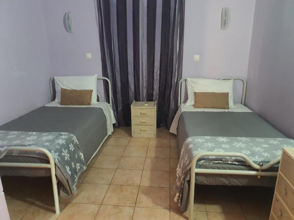 Postel nebo postele na pokoji v ubytování Σπίτι με θέα