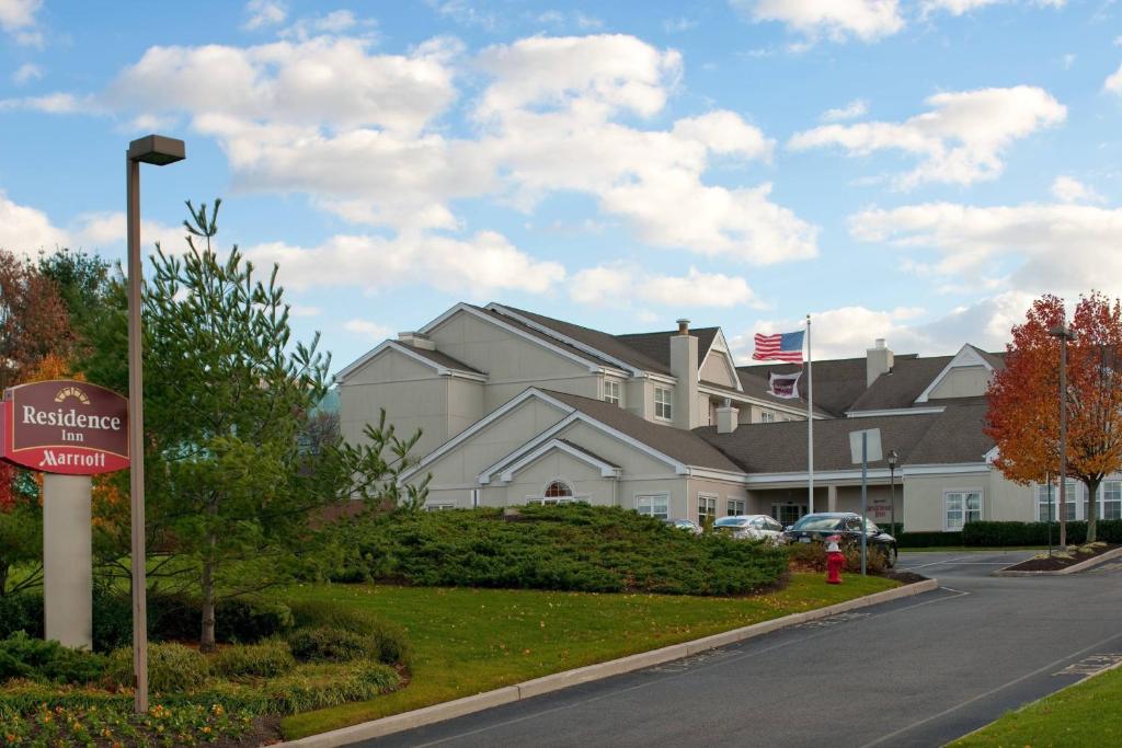 a house with a sign in front of it at Residence Inn Long Island Hauppauge/Islandia in Hauppauge