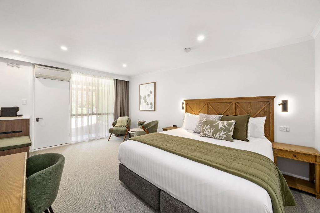 מיטה או מיטות בחדר ב-Beechworth Motor Inn