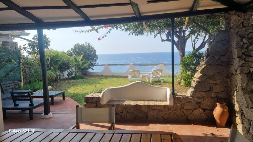 a view of the ocean from the patio of a house at Costa dei Monaci Villas - Tropea in Parghelia