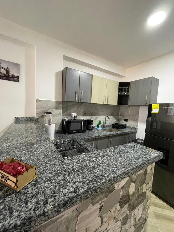 Kuchyň nebo kuchyňský kout v ubytování Moderno apto familiar piso 2