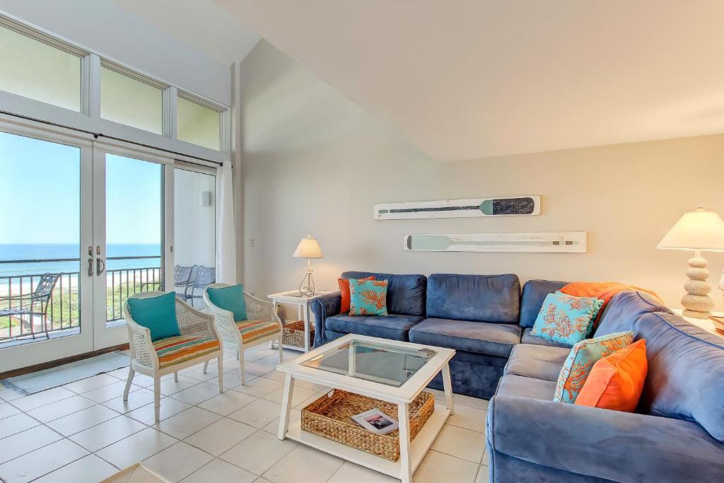 a living room with a couch and a table at 1138 Beach Walker in Amelia Island