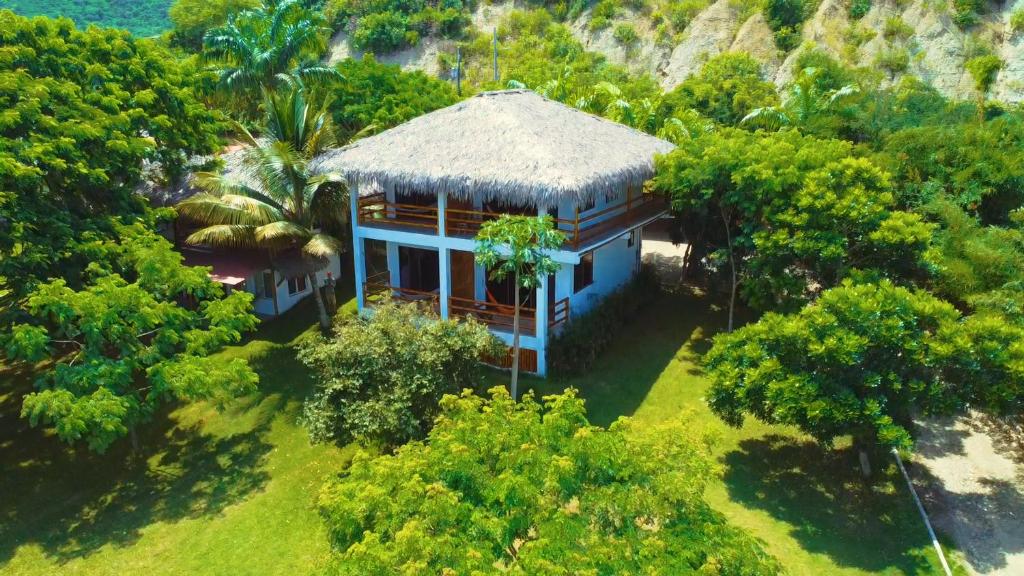 an aerial view of a house in the trees at Hosteria Guachapeli in Las Tunas