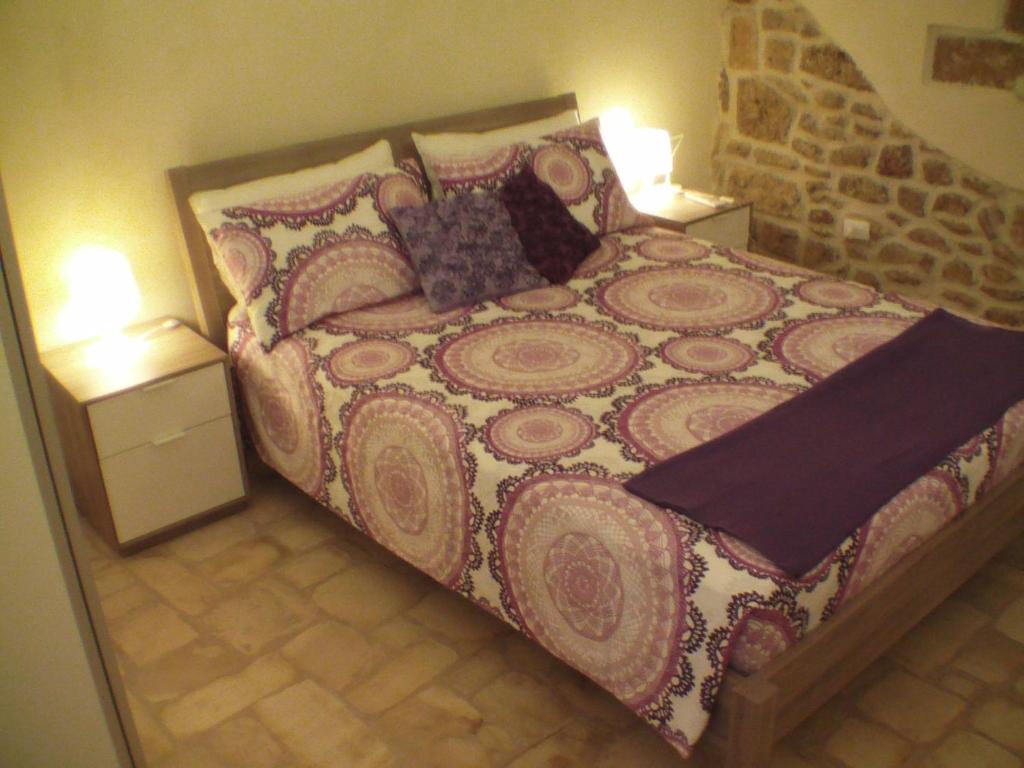 A bed or beds in a room at La Grotta