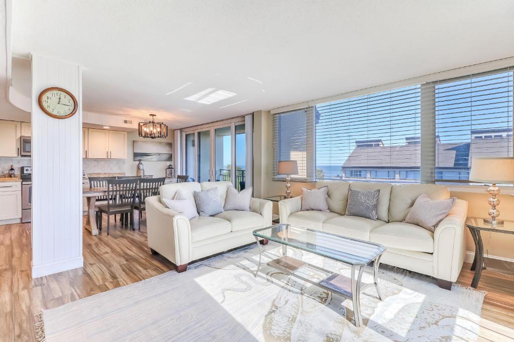 a living room with two couches and a table at 1172 Beach Walker in Amelia Island