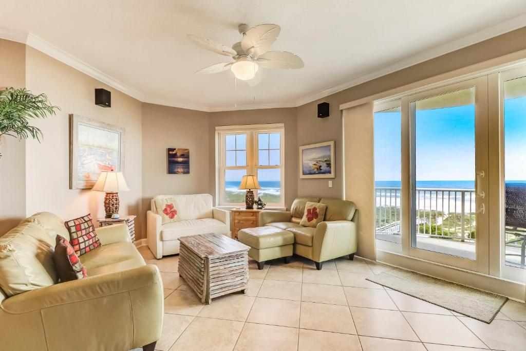 a living room with a view of the ocean at 52 Ocean Place in Amelia Island