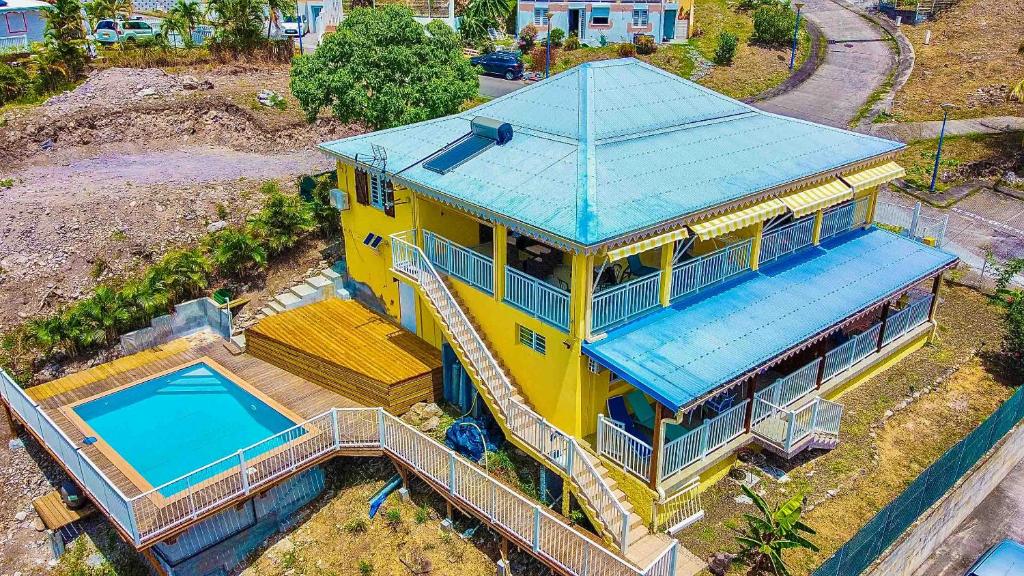 an overhead view of a house with a swimming pool at Océan bleu 972 Beige N 1 in Les Anses-dʼArlets