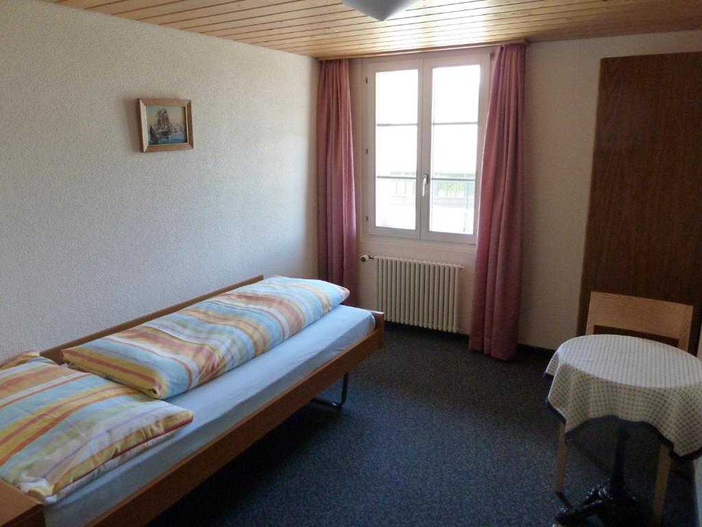 Postel nebo postele na pokoji v ubytování Berghaus Männlichen