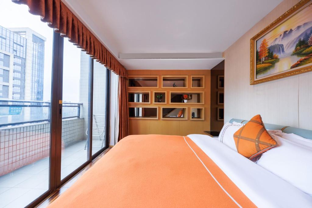 Postel nebo postele na pokoji v ubytování Argyle WAIFIDEN Baolidian Hotel -Free shuttle bus during Canton Fair