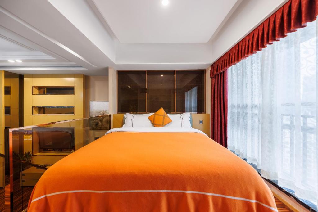 Postel nebo postele na pokoji v ubytování Argyle WAIFIDEN Baolidian Hotel -Free shuttle bus during Canton Fair