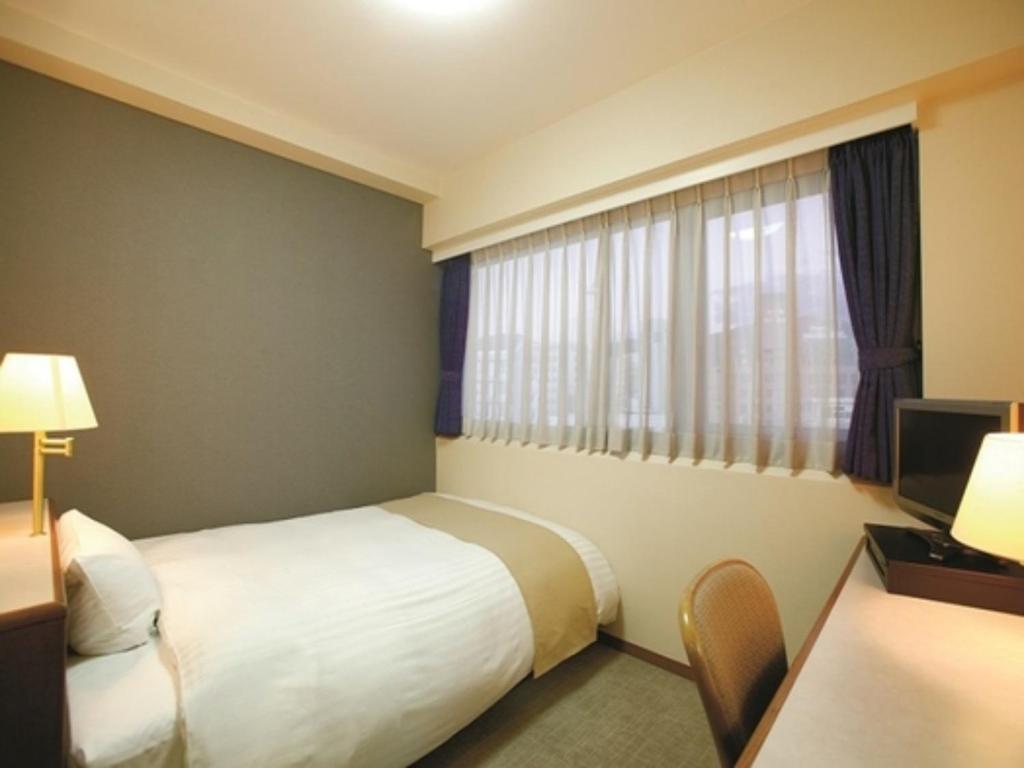 Voodi või voodid majutusasutuse Hotel Montagne Matsumoto - Vacation STAY 73649v toas
