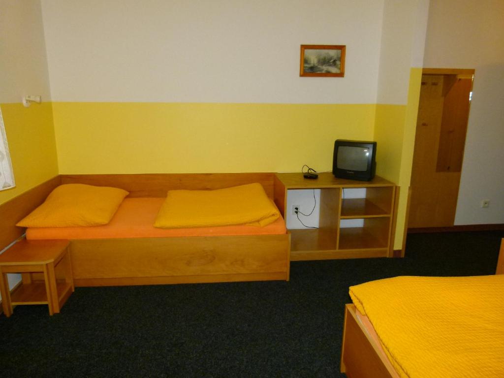 Postel nebo postele na pokoji v ubytování Hotel Pelikan