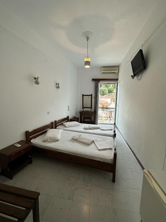 Postel nebo postele na pokoji v ubytování Hotel Galini