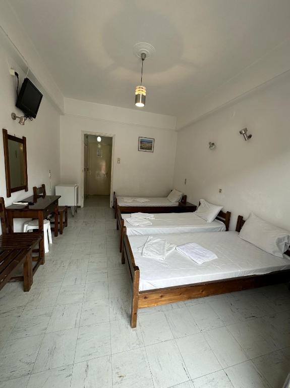 Postel nebo postele na pokoji v ubytování Hotel Galini