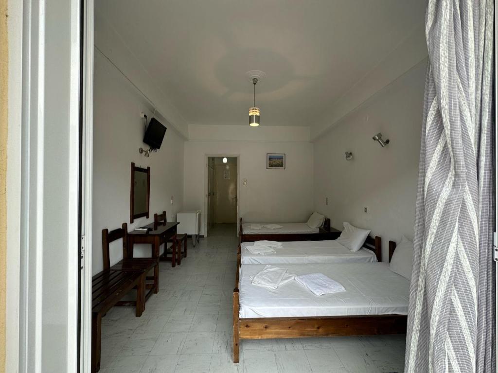 Postel nebo postele na pokoji v ubytování Hotel Galini