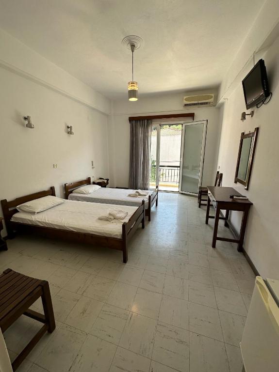 Postel nebo postele na pokoji v ubytování Hotel Galini