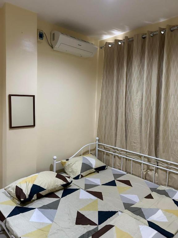 En eller flere senge i et værelse på JMC Residence 3