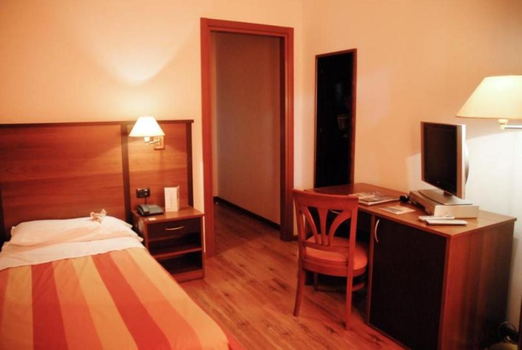 Postel nebo postele na pokoji v ubytování Hotel Bel Sit